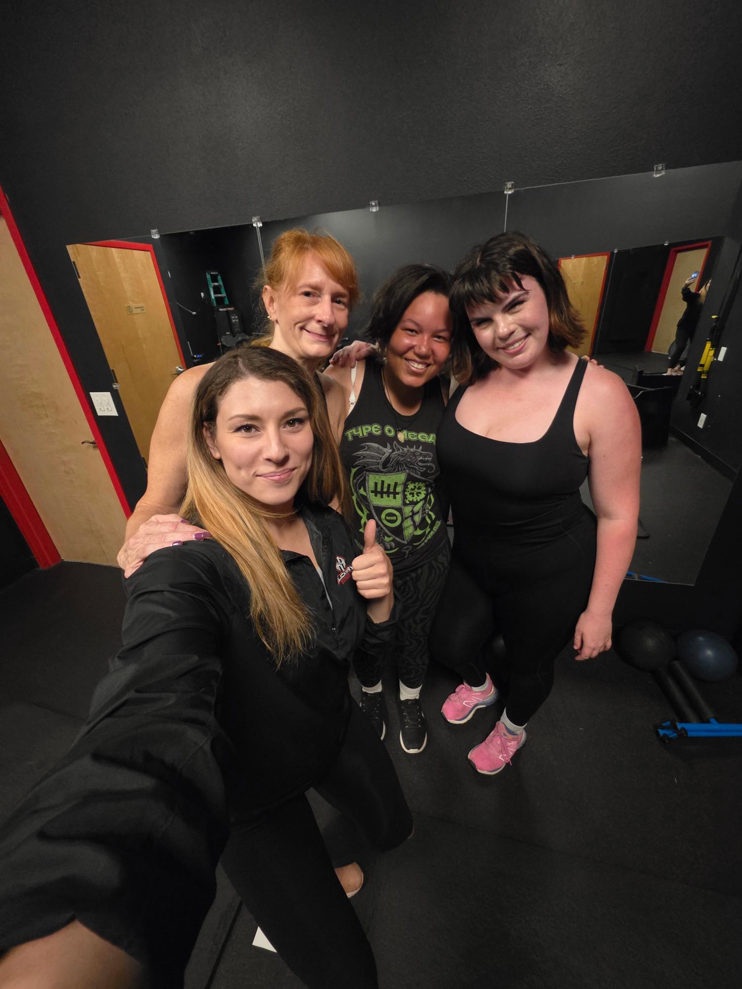 3 girls with instructor pre-workout