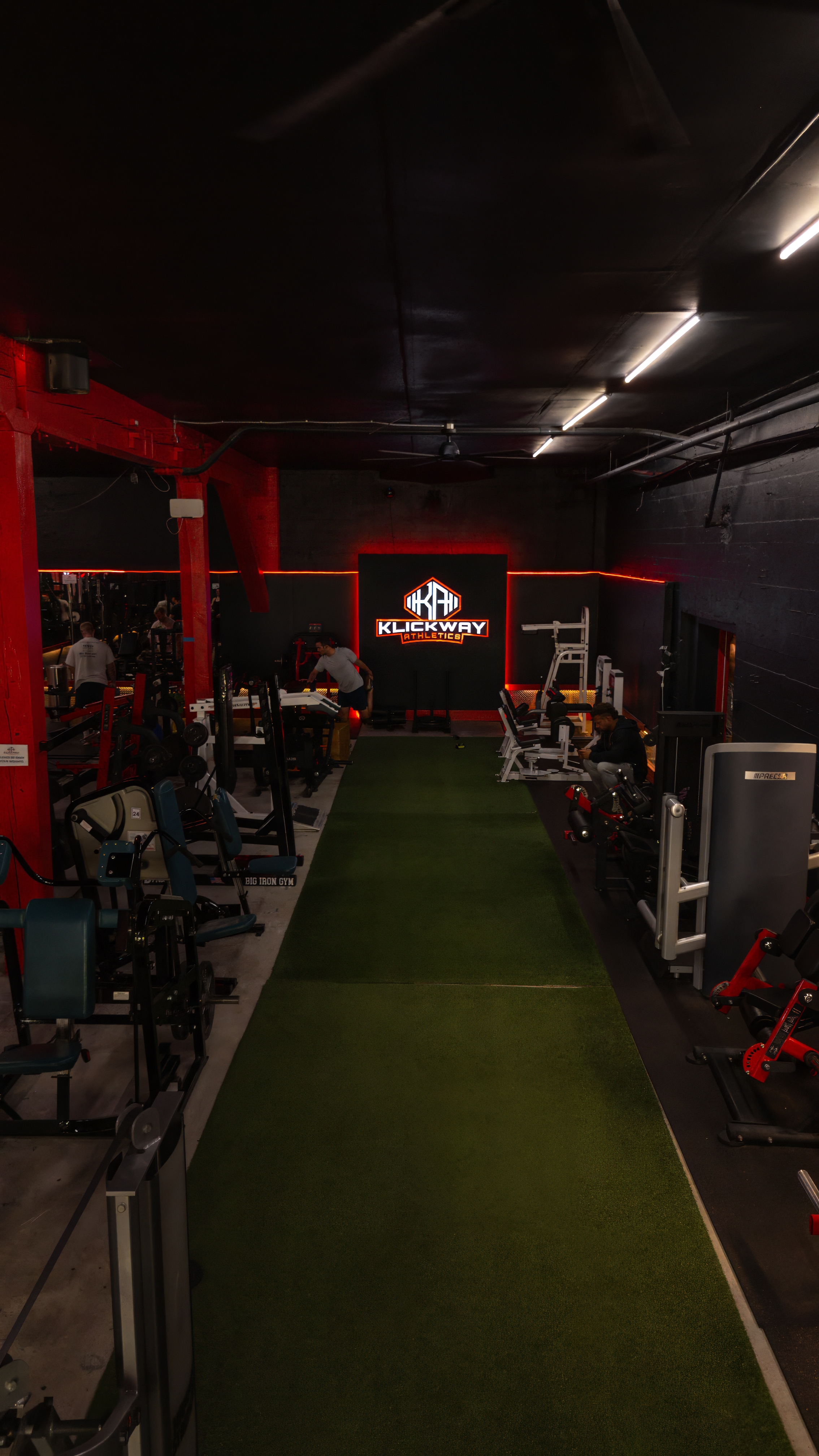 Dedicated indoor turf workout lane ideal for sled pushes, sprints, and functional training